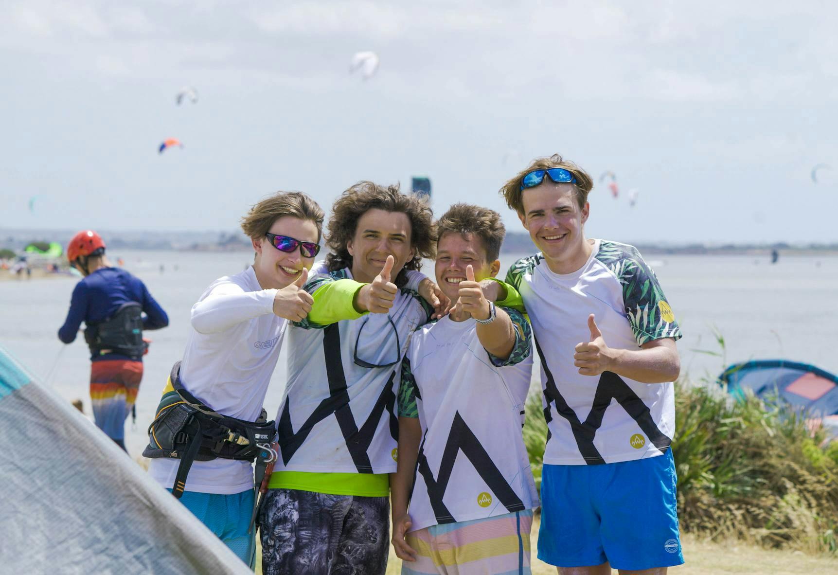 young kitesurf student giving thumbs up and smiling