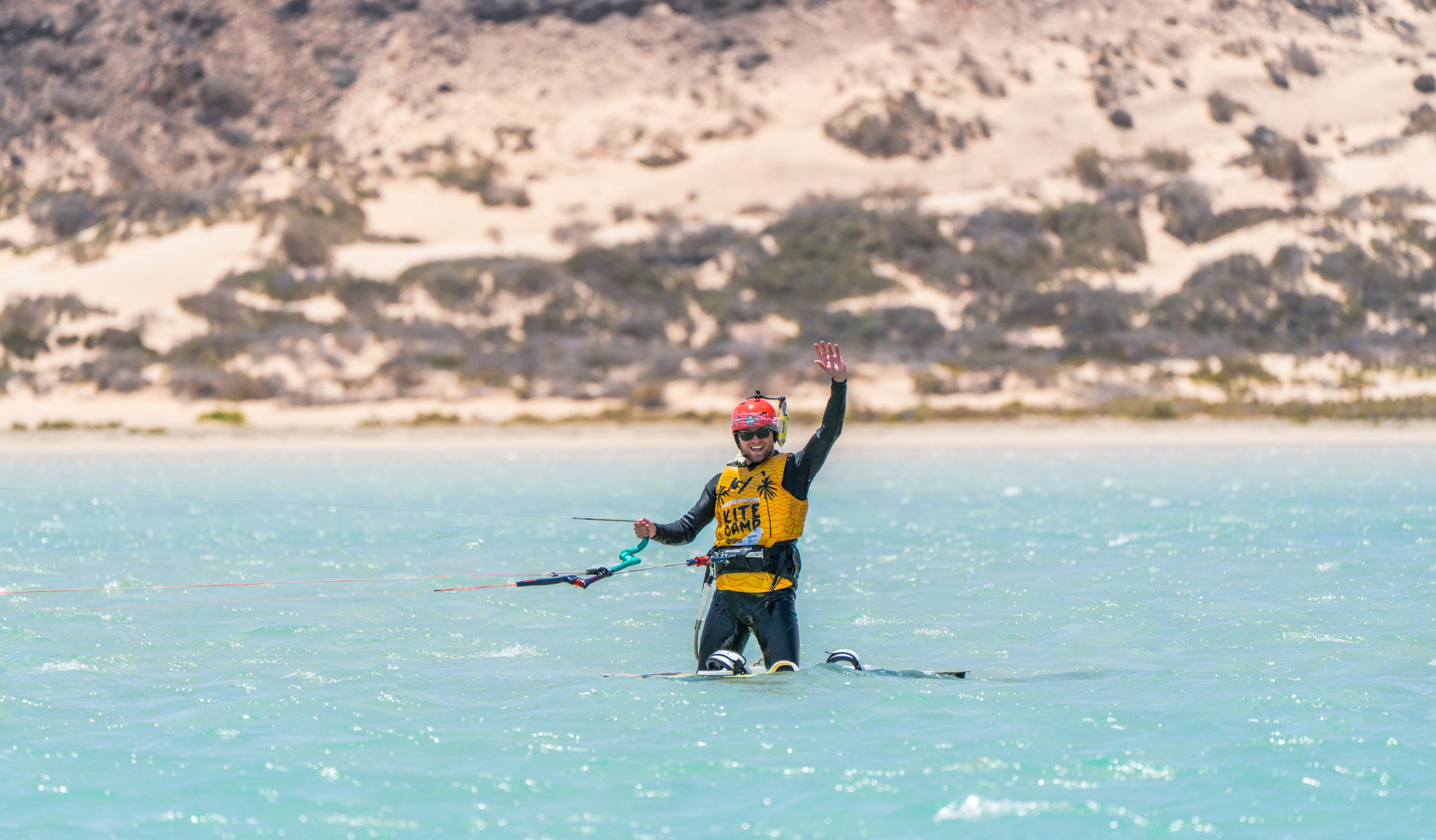 kitesurfer performing a tail grab in Lo Stagnone lagoon