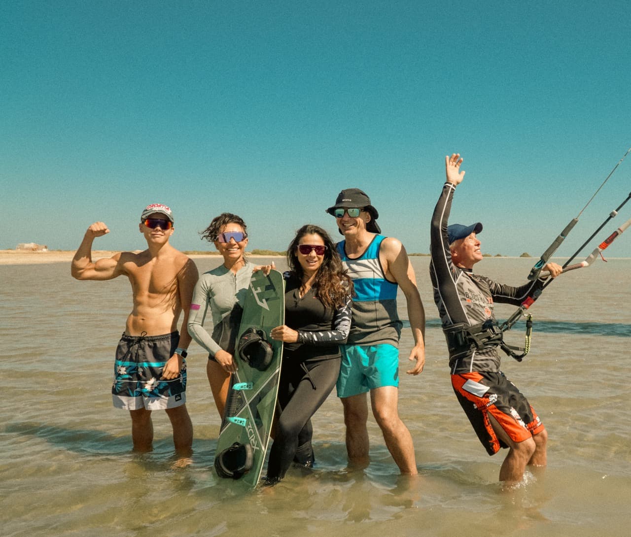 kite student waving with a smile on his face